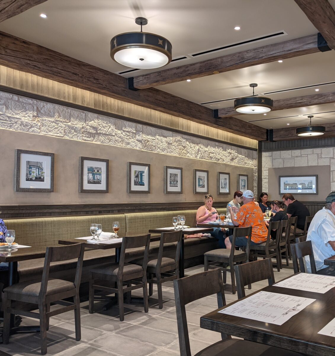Guests sitting inside La Creperie de Paris restaurant in the France Pavilion of the World Showcase in Epcot