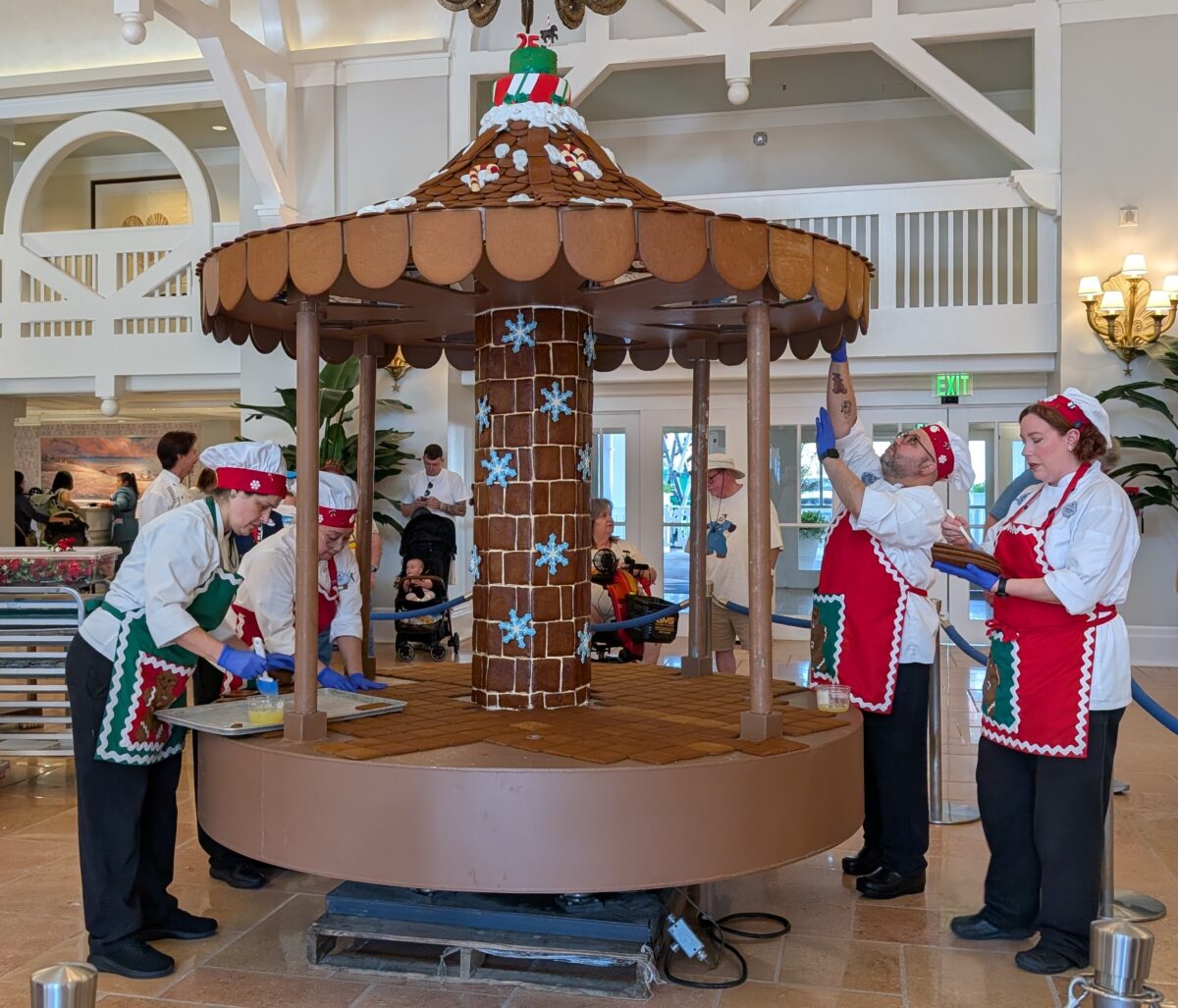 A picture of a group of chefs working on the gingerbread carousel for 2025 at Disney's Beach Club in Orlando, Florida.