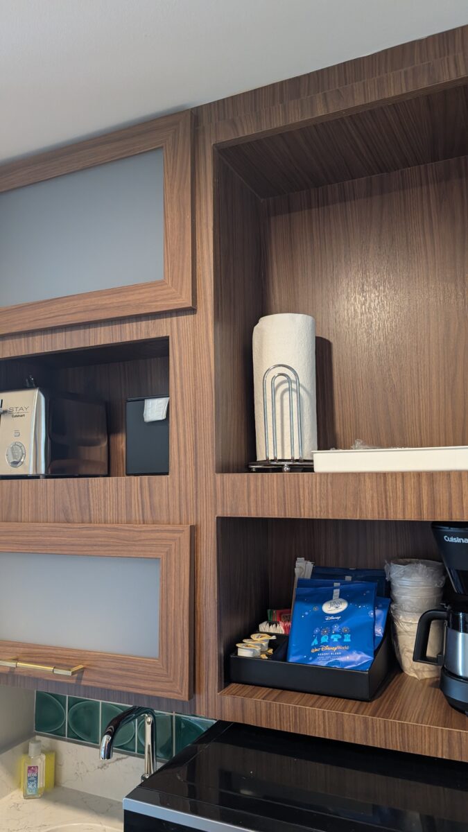 A picture of paper towels, a toaster, and other items at the kitchen section of a Bay Lake Tower guest room at Disney's Contemporary Resort in Orlando, Florida.