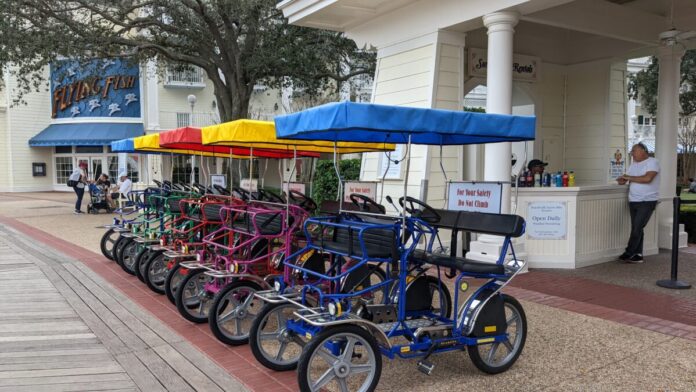 A picture of the surrey bikes you can rent at Disney's Boardwalk in Orlando, Florida.