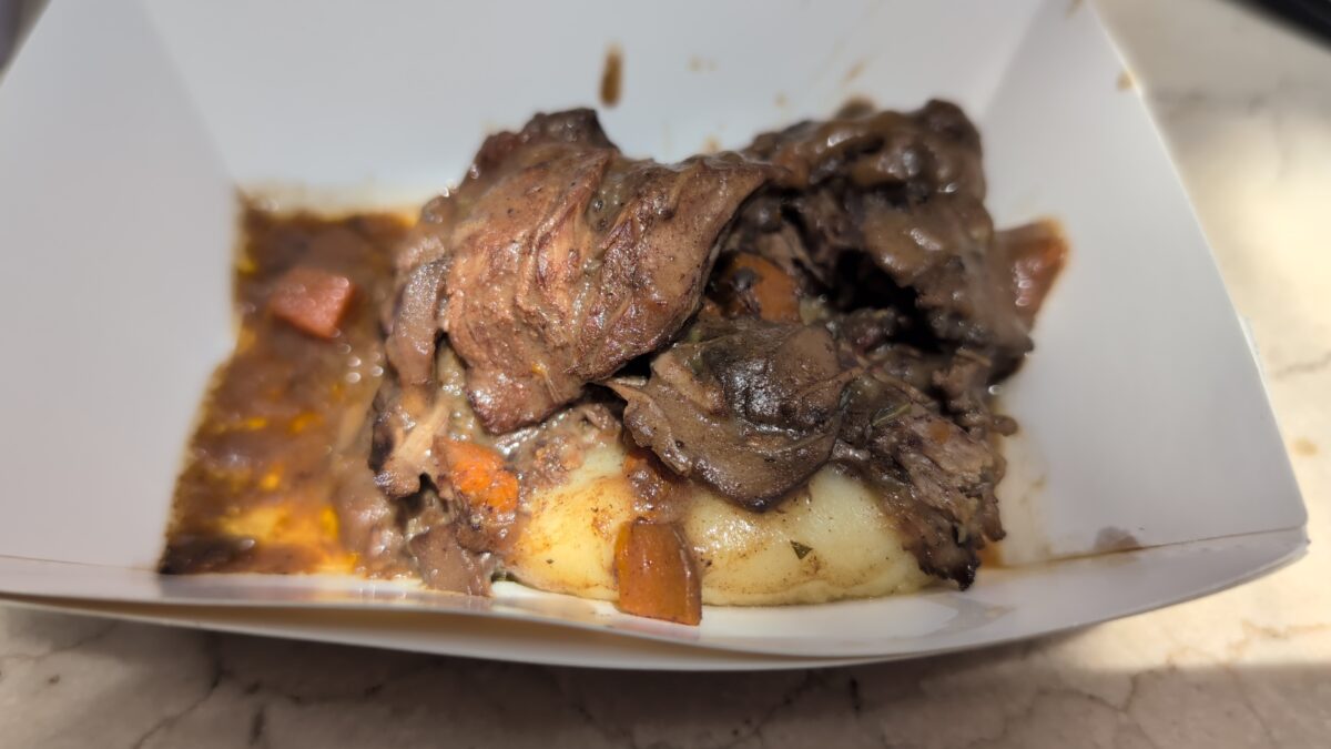 A picture of the Boeuf Bourguignon, Purée de Pommes de Terre from the France pavilion of Epcot at Disney World during the Food and Wine Festival