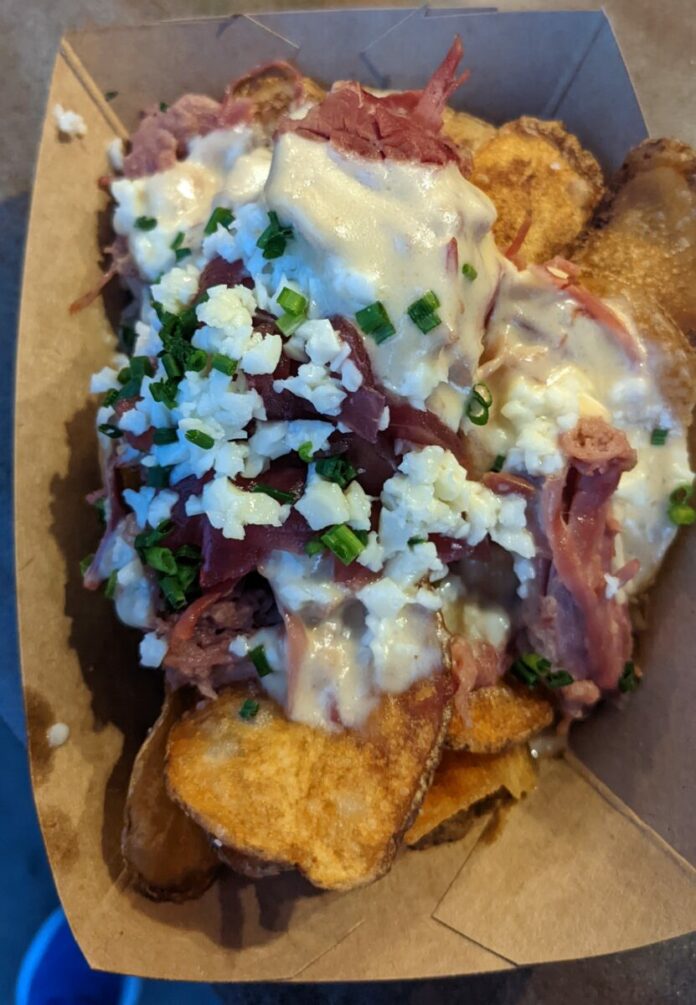 A picture of the Smoked Corn Beef, our favorite food item from Flavors from Fire booth at the Epcot International Food & Wine Festival in Orlando, Florida