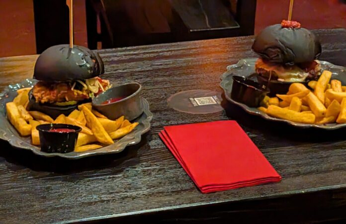 A picture of burgers from Das Stakehaus at Epic Universe theme park in Orlando, Florida.