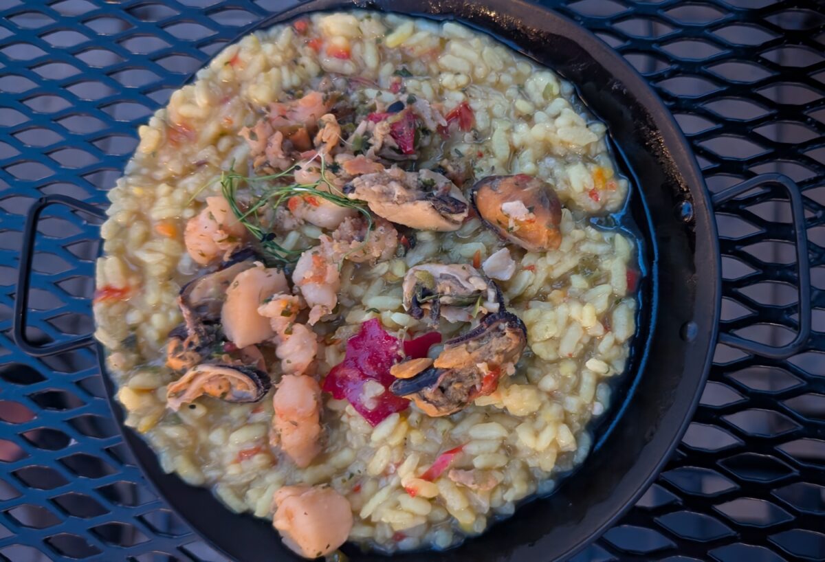 A picture of the Paella Caldoso from the Spain global marketplace at the Epcot Food and Wine Festival at Disney World.