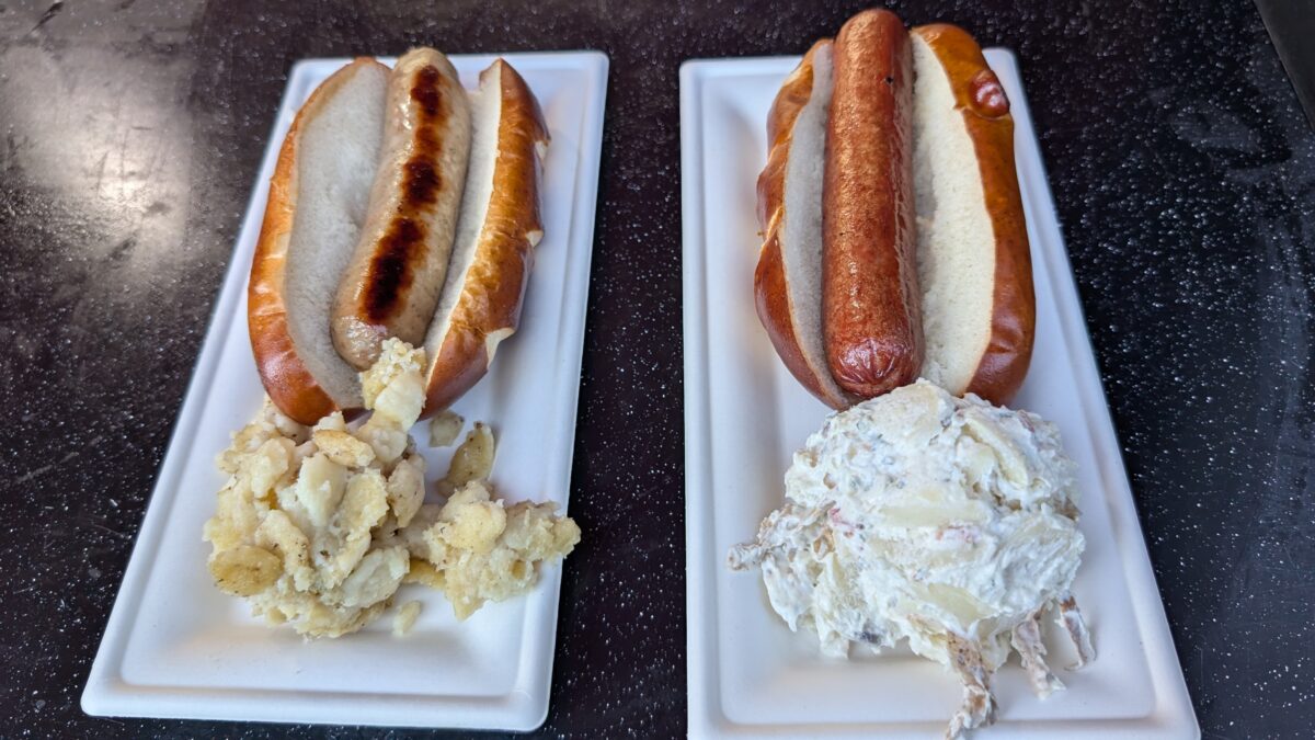 Bratwurst with a side of German spätzle and Frankfurter with a side of German potato salad, served at Oktoberfest Carowinds