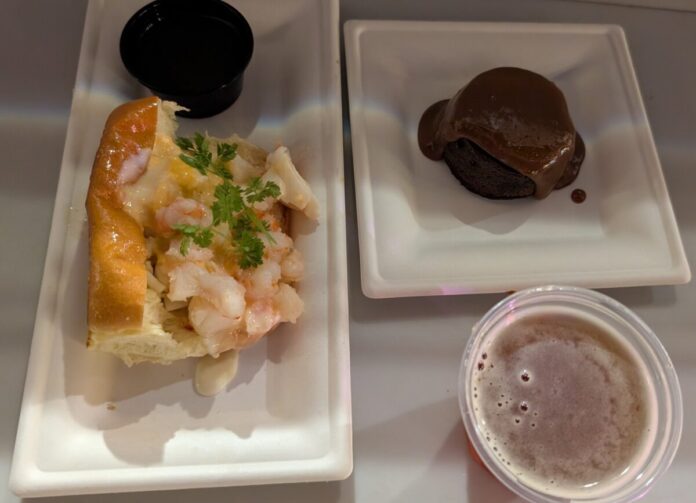 A picture of a gulf coast seafood roll, wine, and chocolate cake from the Flavors of America booth at the Epcot Food and Wine Festival in Orlando, Florida.