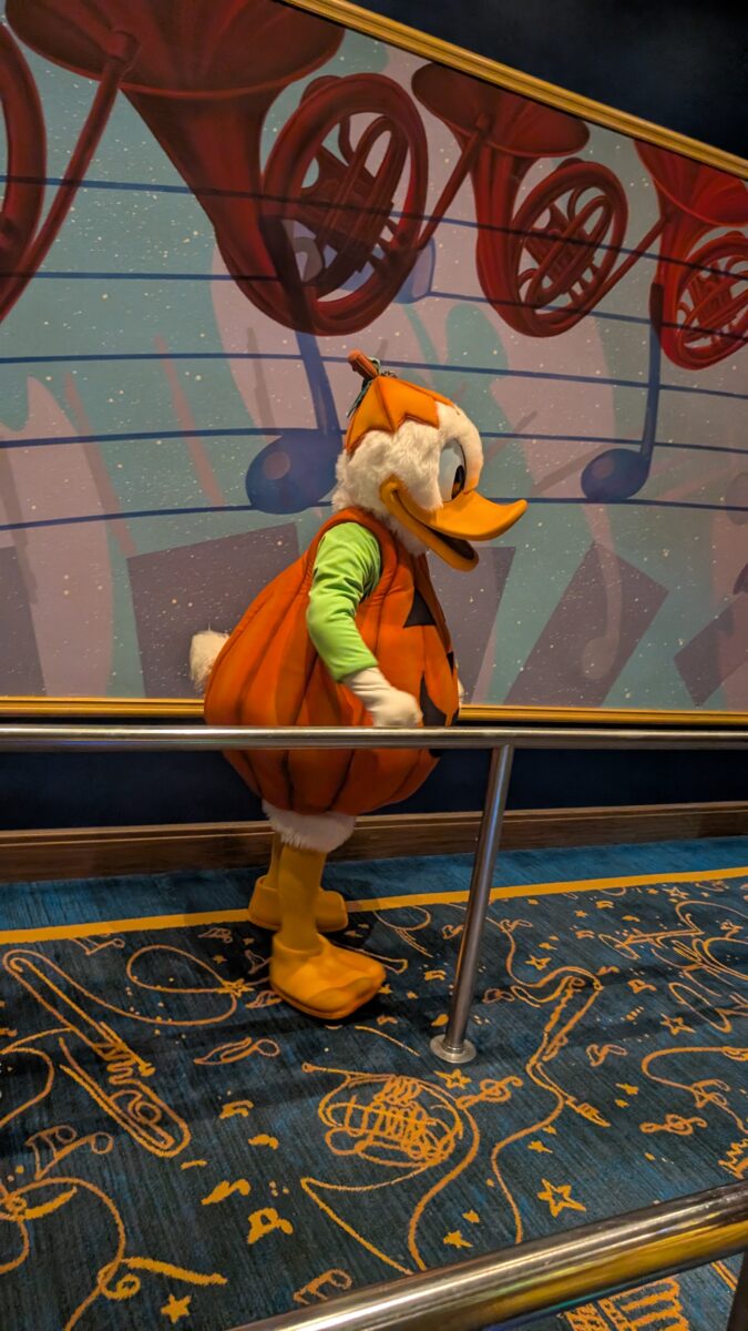 Donald Duck in a jack-o'-lantern costume at Mickey's PhilharMagic during Mickey's Not So Scary Halloween Party