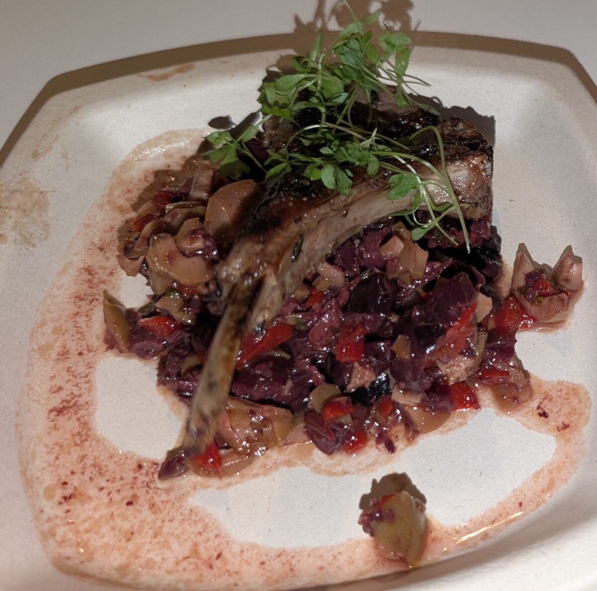 A picture of the lamp chop with olive tapenade from SeaWorld Orlando's Christmas Celebration