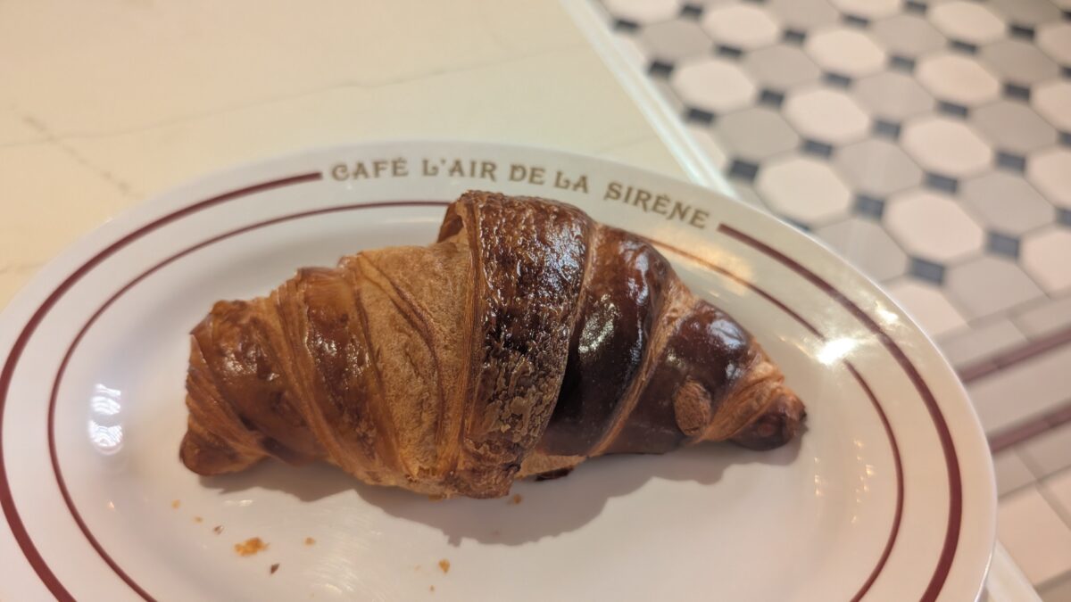 A picture of a croissant from Café L'air De La Sirene, a restaurant at Epic Universe in Orlando, Florida.