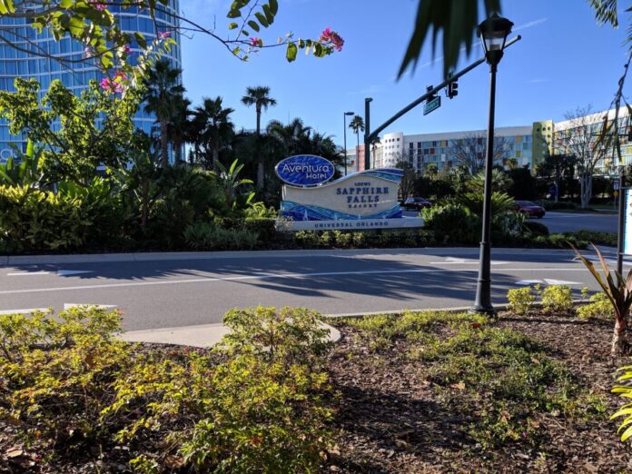 Universal Orlando Hotels Sign for Universal Aventura Hotel and Loews Sapphire Falls Resort with Cabana Bay Beach Resort in the background