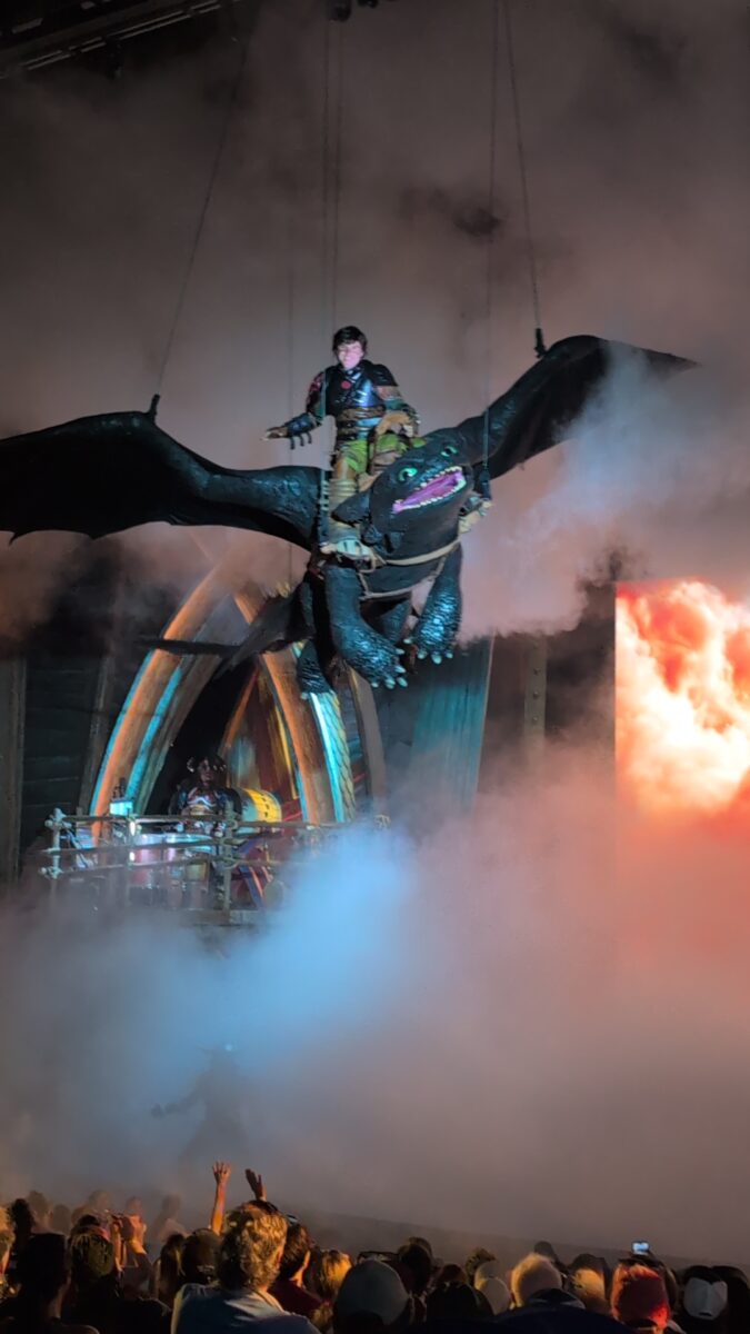 Dragon flying over the audience at The Untrainable Dragon, a show at Isle of Berk at Universal's Epic Universe theme park